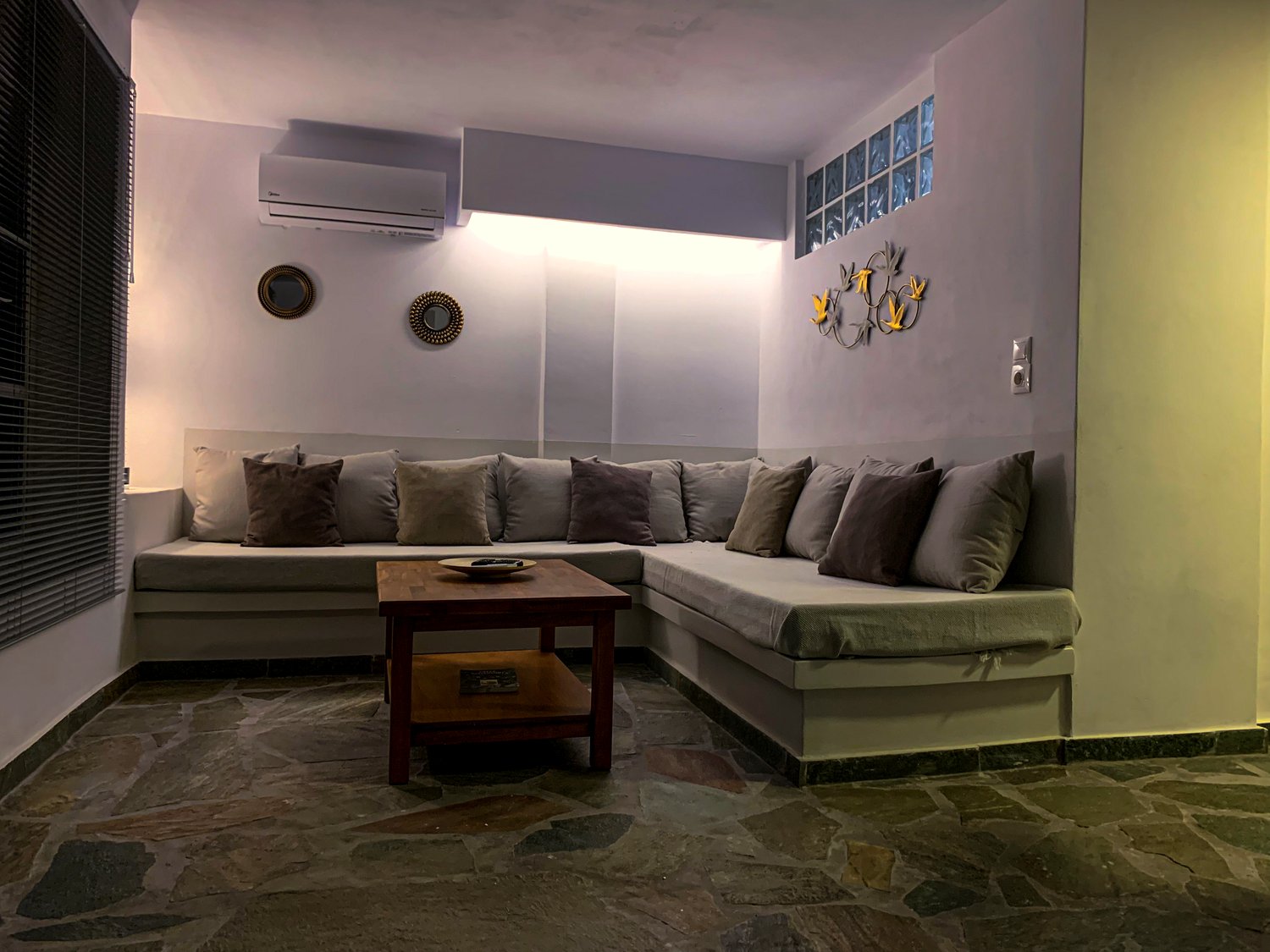 The living-room lounge of Verros Suite with an L-shaped sofa